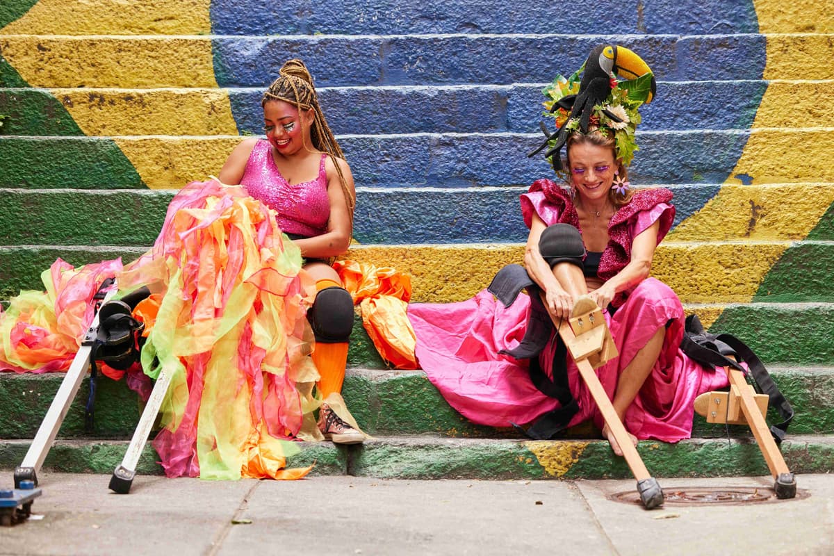 a-couple-of-women-sitting-next-to-each-other