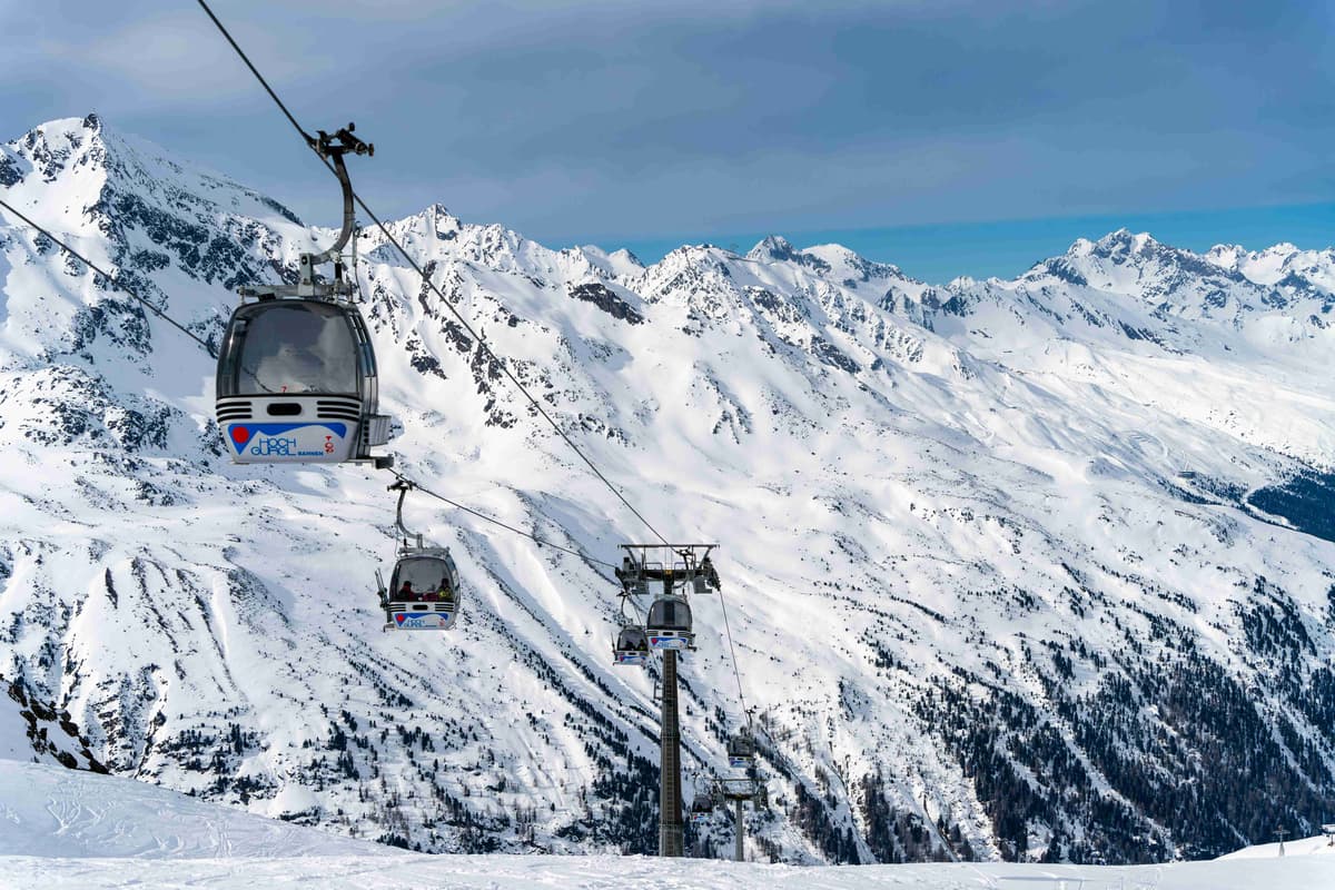 a-ski-lift-going-up-the-side-of-a-snow