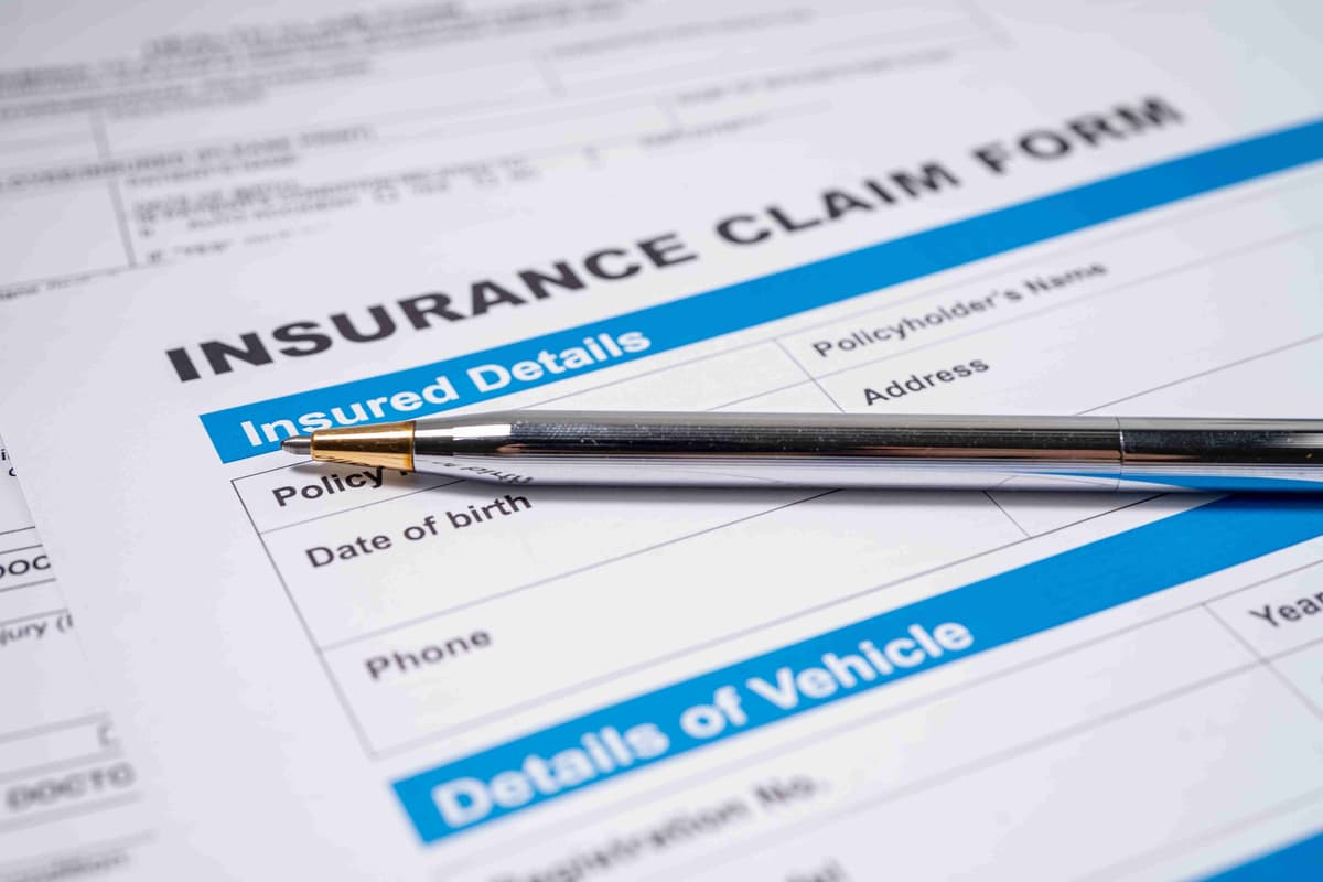 Pen on Insurance claim accident car form