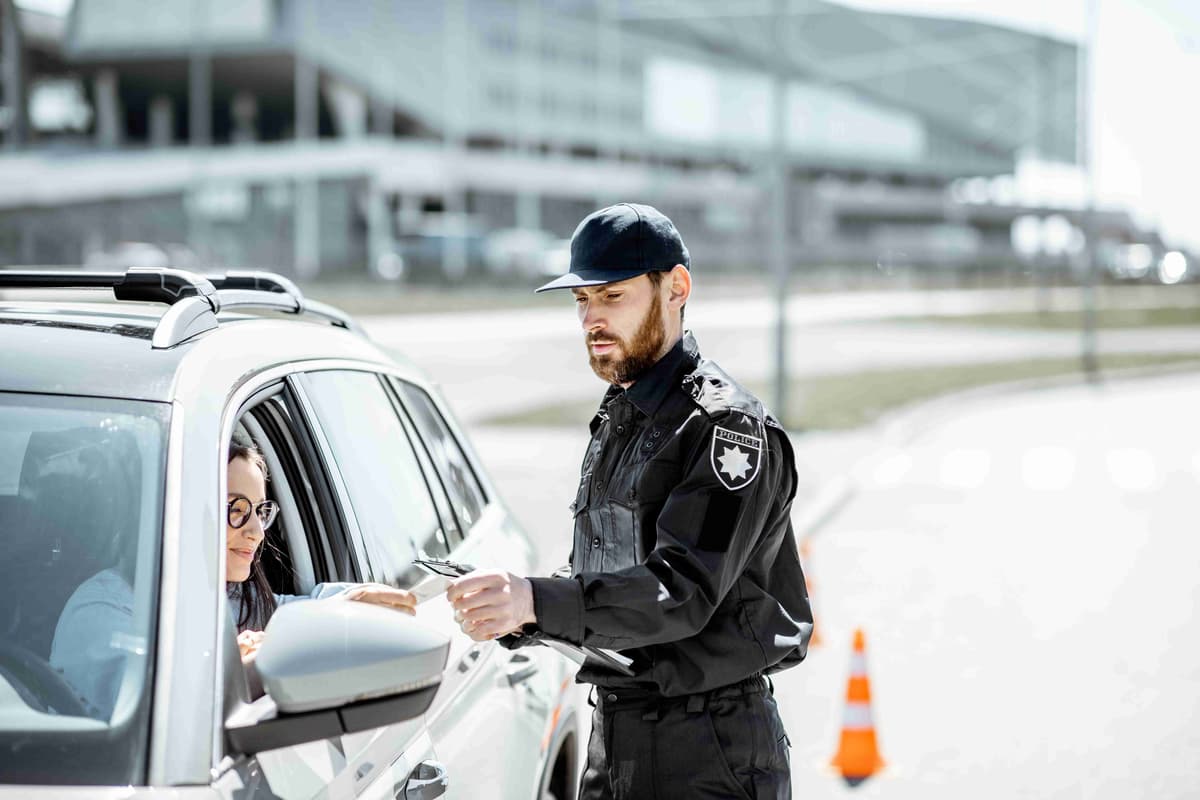 policeman-with-woman-driver-on-the-road