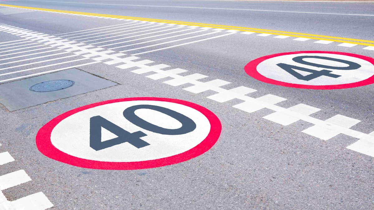 Speed limit sign and safety rumble stripe traffic