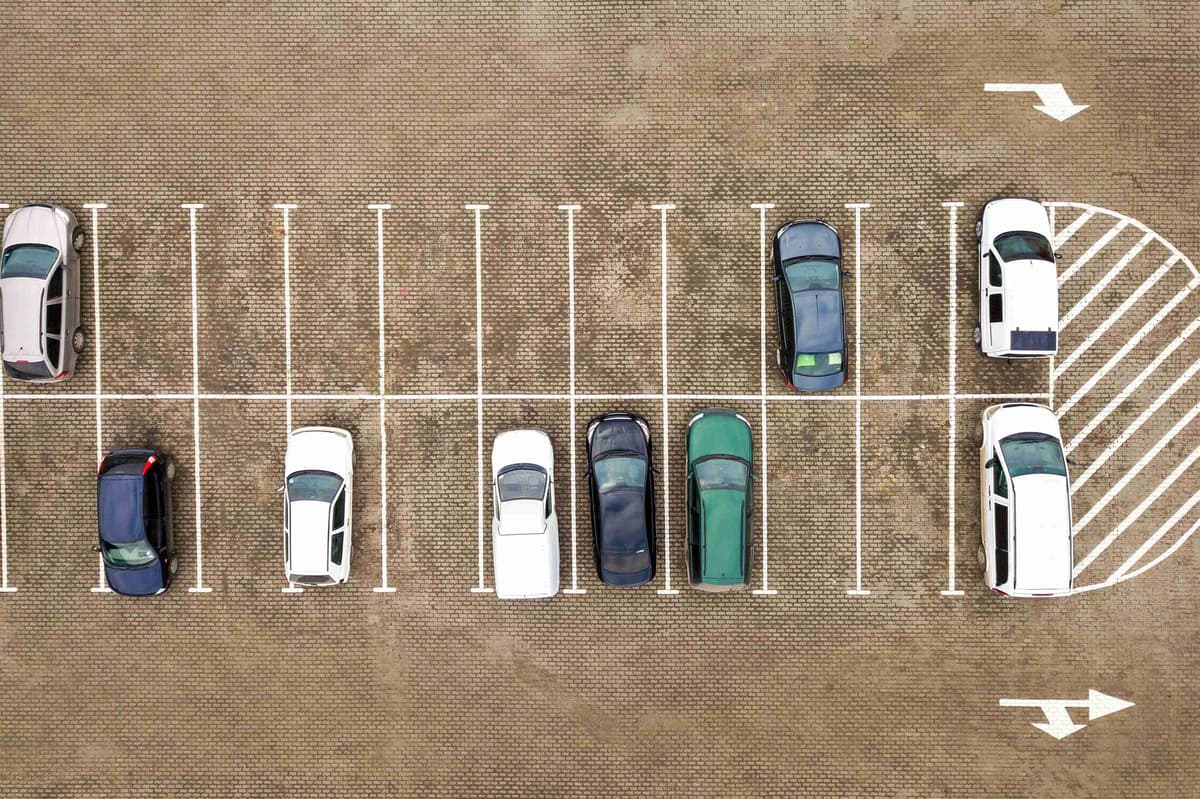 top-down-aerial-view-of-many-cars-on-a-parking-lot