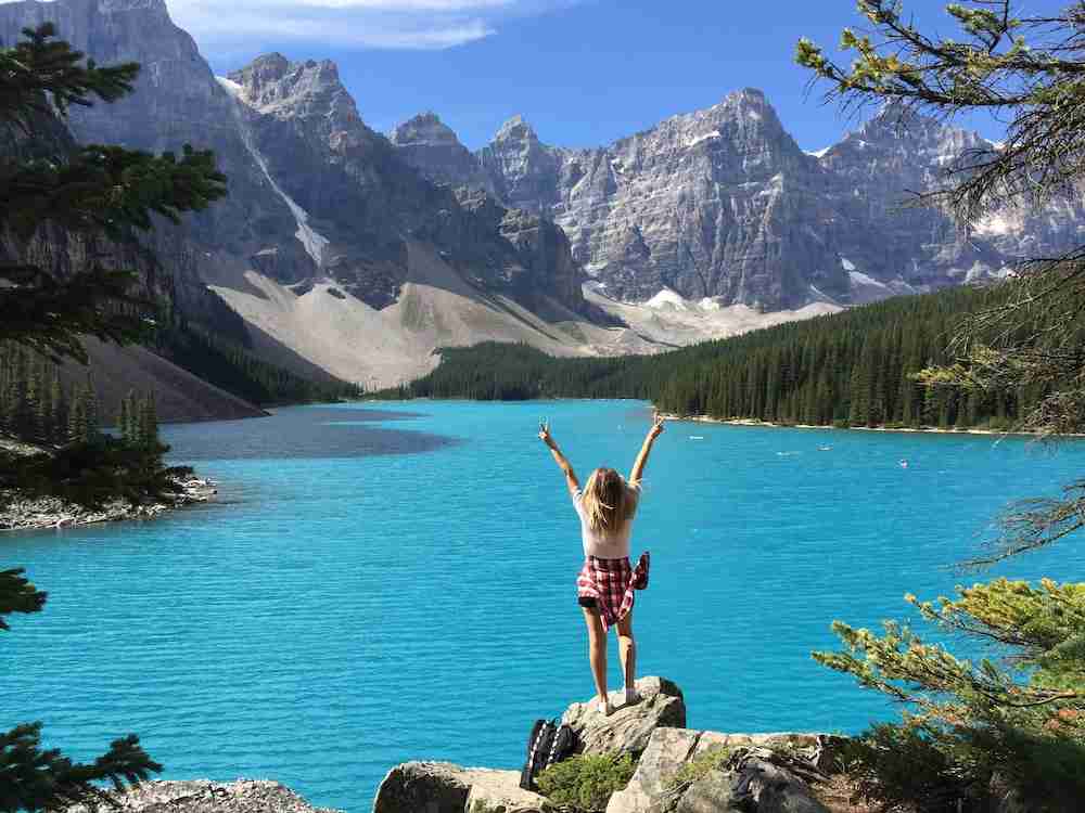 woman standing on rock in Banff National Park