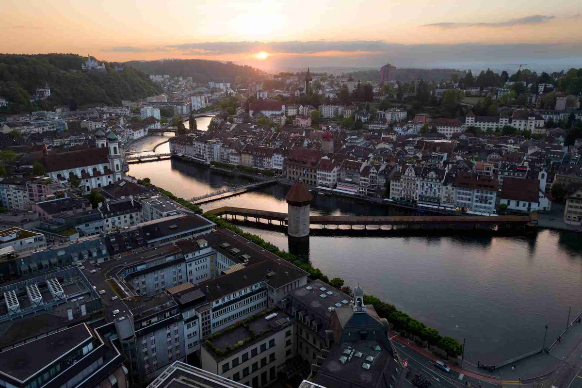 Aerial View of Cityscape with River and Bridges at Sunset