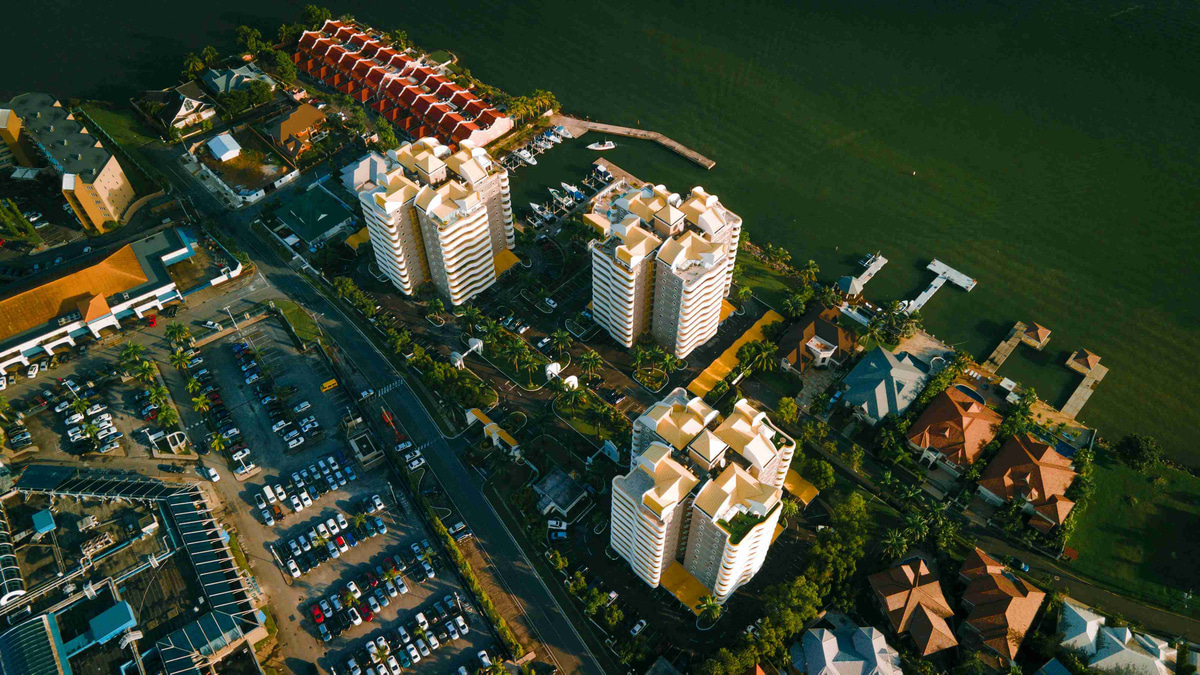 Aerial_View_of_Coastal_City_with_Apartments_and_Marina_at_Sunset