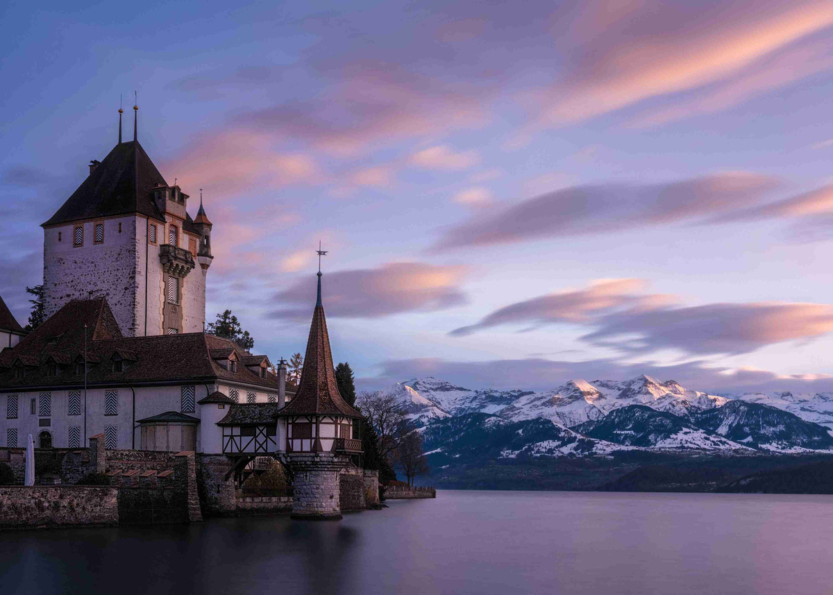 Castle_by_the_Lake_at_Dusk_with_Mountain_Backdrop