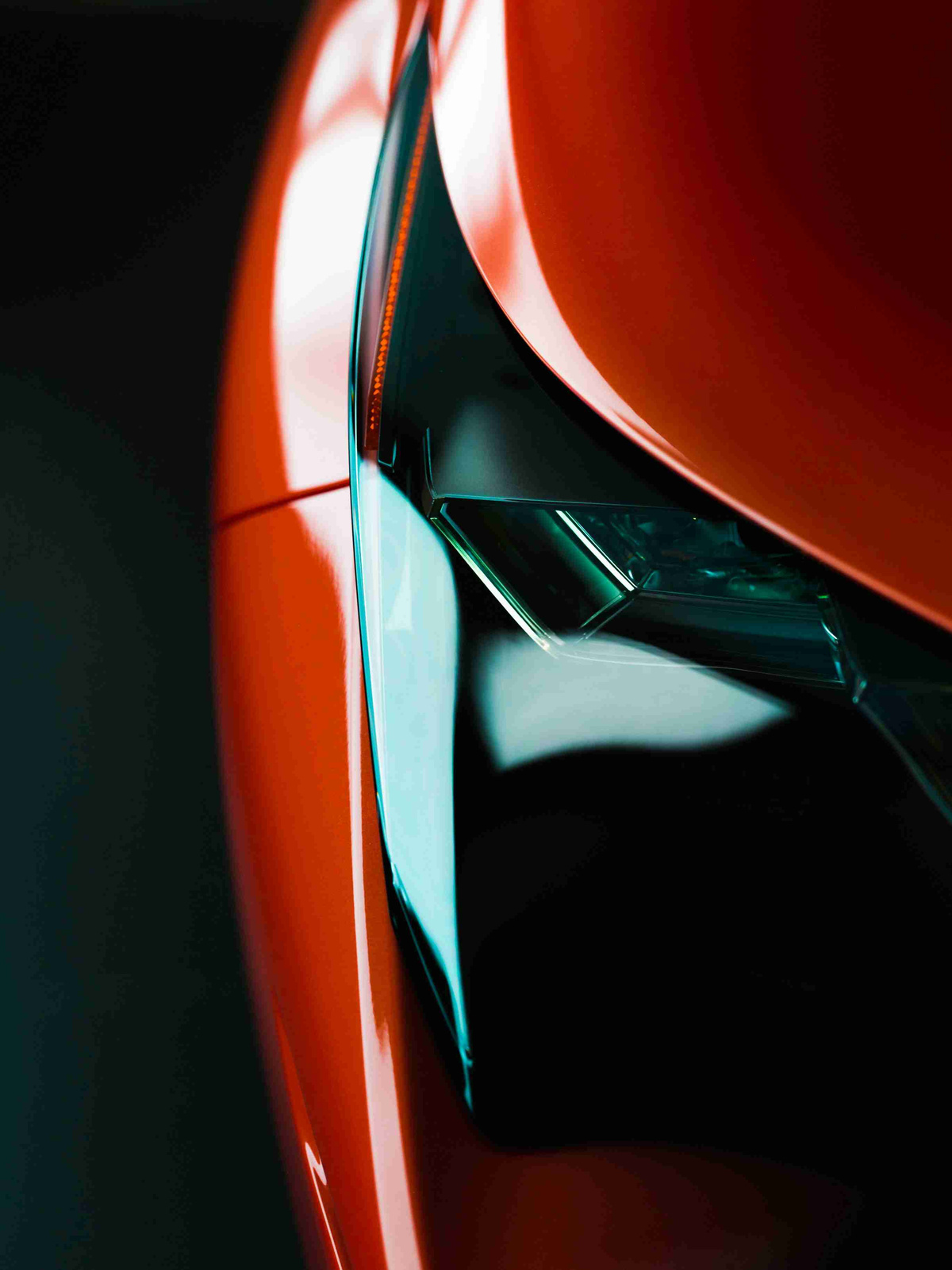 Closeup_of_Red_Sports_Car_Headlight
