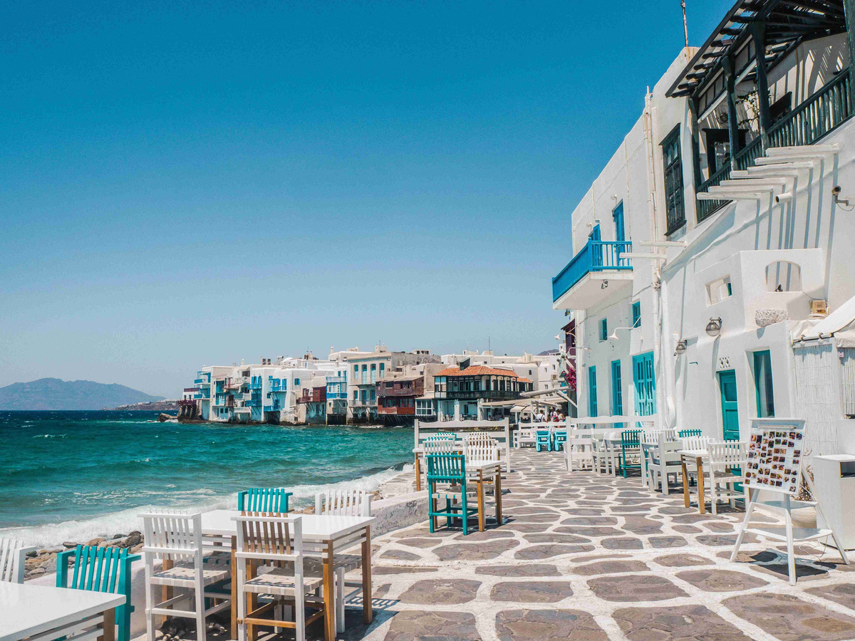 Coastal_View_of_Mykonos_with_Turquoise_Waters_and_White_Washed_Buildings