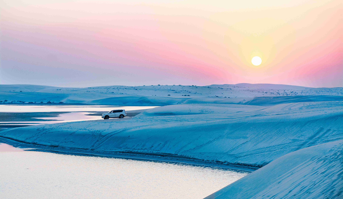 Pastel_Sunset_Desert_Dunes_with_Lone_Vehicle