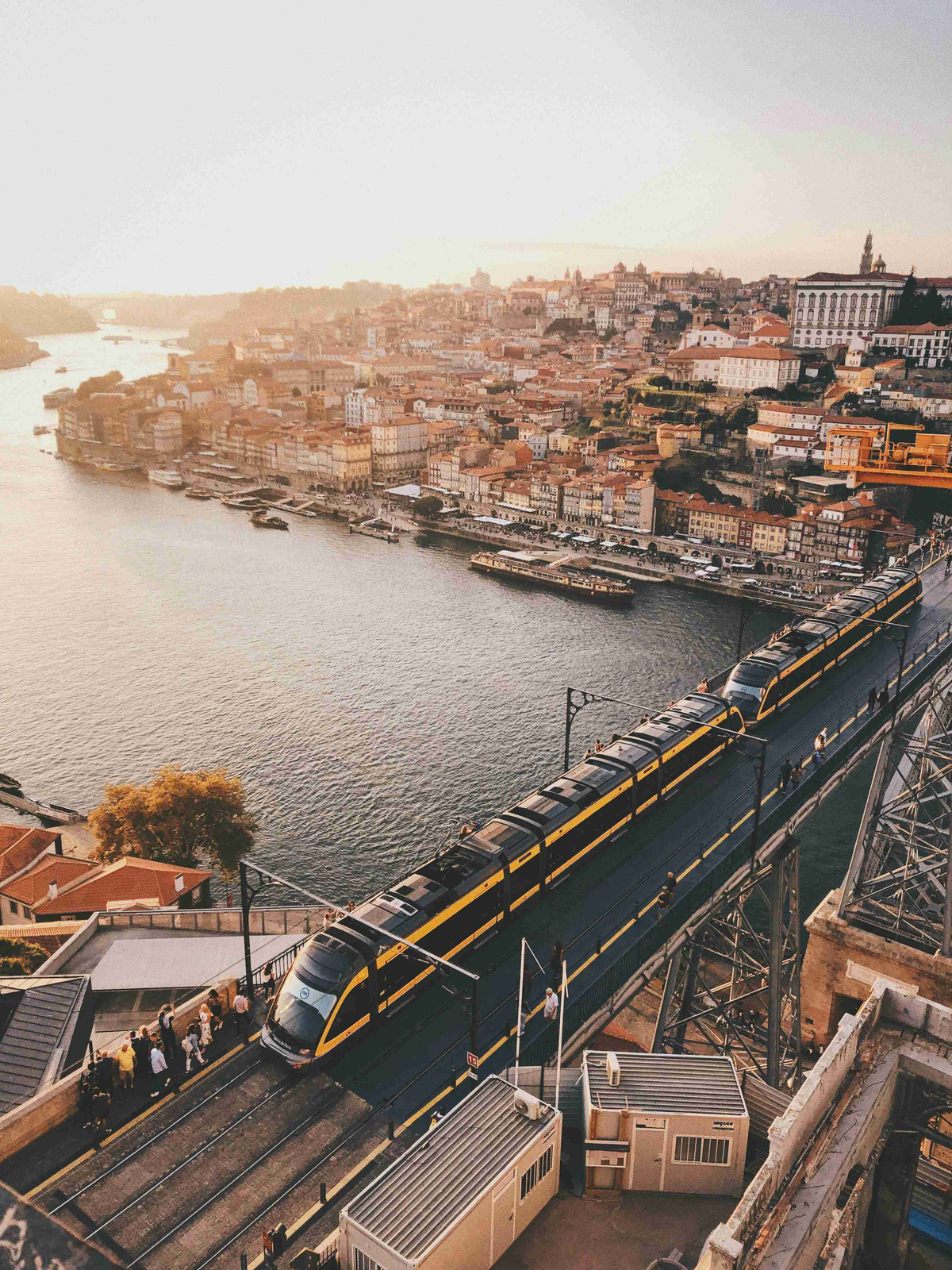 Sunset_View_of_Train_Crossing_Bridge_in_Porto_Portugal