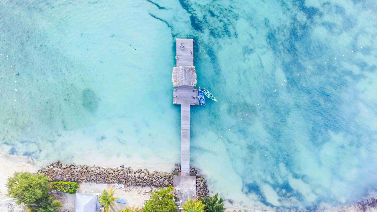 Tropical_Pier_Over_Turquoise_Waters_Aerial_View