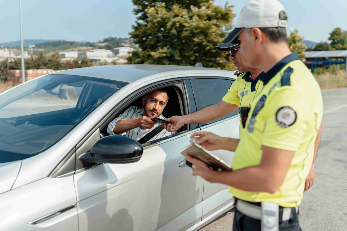 driver-handing-id-to-police-officer