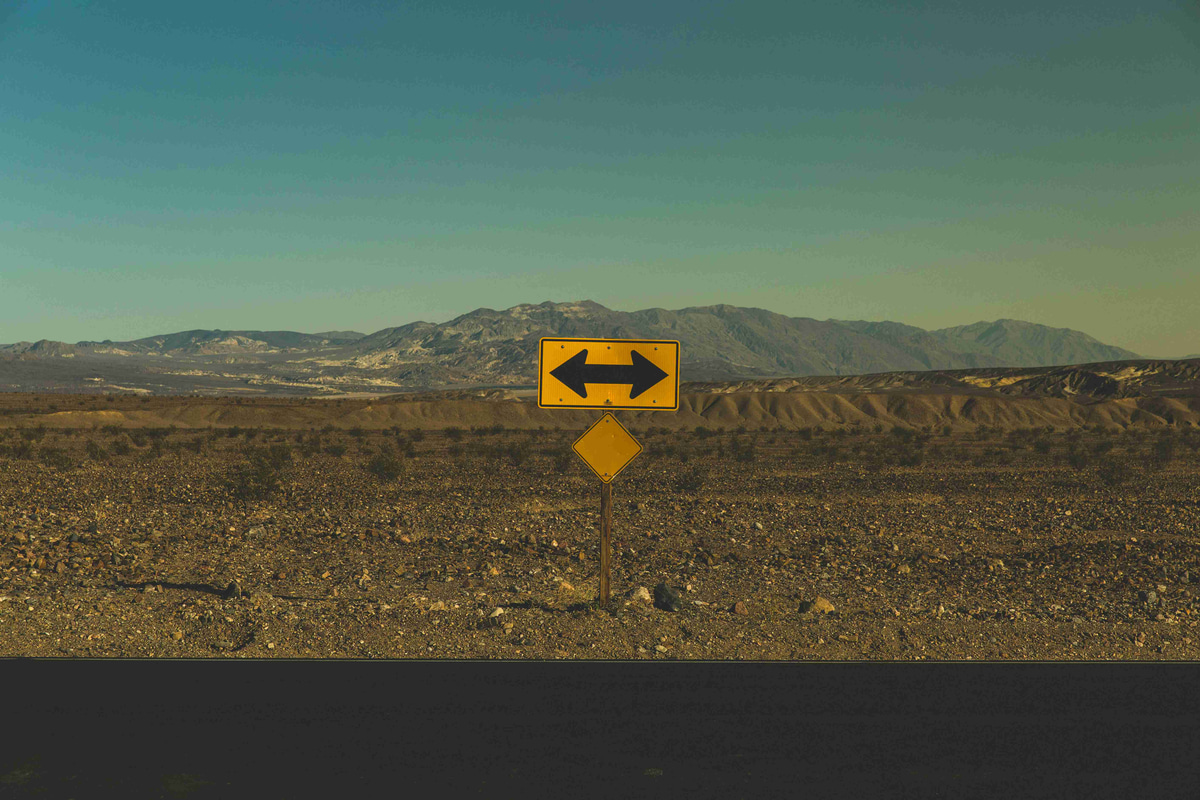 Desert-Crossroads-Yellow-Sign